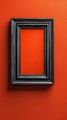 Empty black wooden frame on bright textured orange wall interior background.