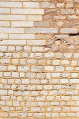 Mixed masonry wall of stone and brick