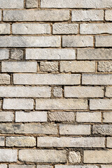 Rough stone brick wall with textured surfaces