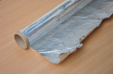roll of aluminum food foil on the table