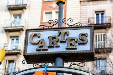 Vintage-style CARTES sign with aged golden letters