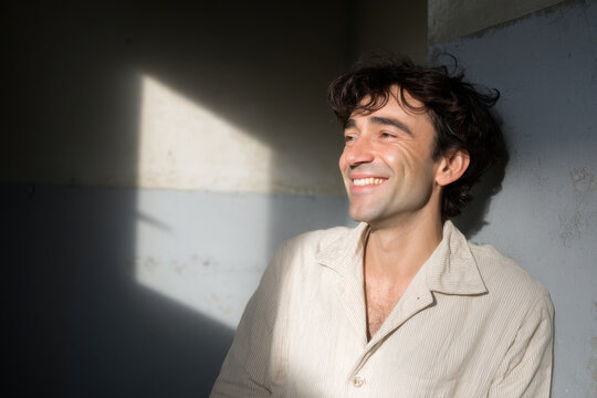 dynamic portrait of lapta player on left side of frame joyful expression