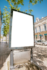 Blank billboard on tree-lined European sidewalk - mockup