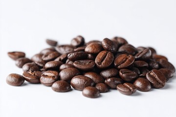 A close-up shot of a pile of dark roasted coffee beans.