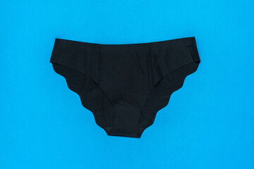Black Women's Seamless Lingerie Against Vibrant Blue Background for Modern Fashion Trends