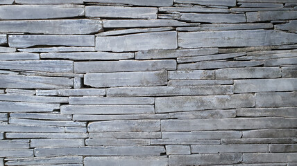 Modern brick stone texture background. Exterior or interior design pattern with natural stone wall...