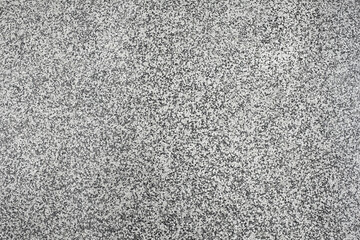 Terrazzo marble tile texture background, small black, grey and white stones, smooth and shiny texture.