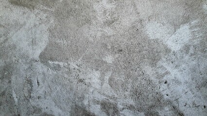 Close-up of cement wall background, old gray cement wallpaper, rough or uneven surface, construction work on building or structure floor.