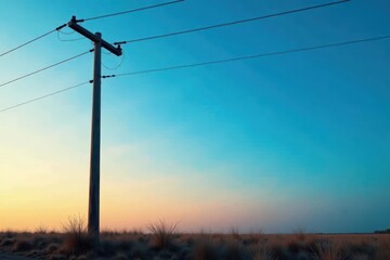 A solitary weathered electric pole silhouetted against a vibrant blue sky , power, wire