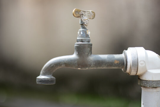 Close up rusty faucet outdoors