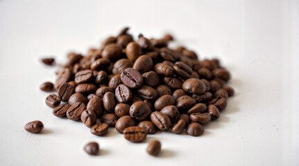 Roasted coffee beans pile from top on white background. High quality photo
