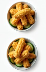 Naklejka premium Crispy fried pickles with cucumber slices in white bowls. Delicious snacks or appetizers for party. Appetizing treat for gatherings. Fried food concept.
