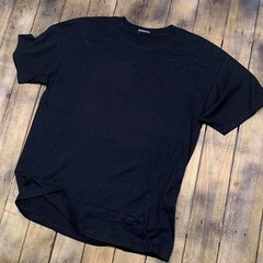 Vintage style t-shirt mockup with an aged 90s look stretched on rustic wood