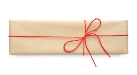 Gift wrapped in kraft paper with bow isolated on white, top view