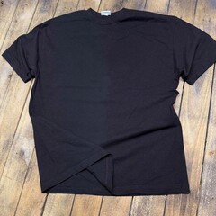 Vintage style t-shirt mockup with an aged 90s look stretched on rustic wood