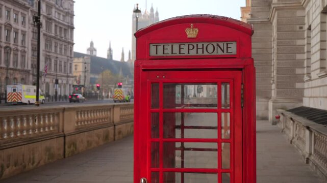 Stunning and captivating frames of classic red telephone booths located in London, showcasing their iconic design against the diverse urban backdrop that makes the city so uniquely beautiful