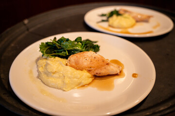 Plated chicken dinner served at formal event reception