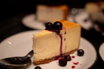 Slice of cheesecake with blueberry topping on a dessert plate