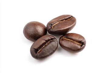 Close-up of four dark roasted coffee beans against a bright white background.