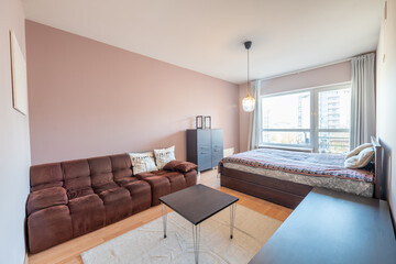 Modern Home Apartment Room Featuring Stylish Furniture and Natural Lighting