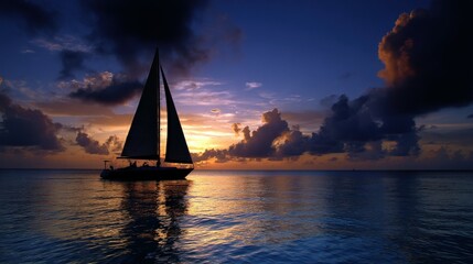 Fototapeta premium Sailing into the sunset with vibrant clouds reflecting on tranquil water