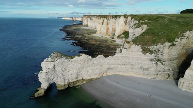 Aerial high angle shot of etretat and famous natural landmark Falaise of Aval white cliffs