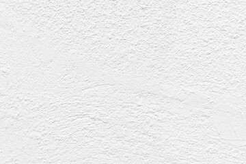 White concrete wall texture background. Uneven render stucco white painted concrete wall texture background. Rough and grunge stucco wall in the sun.
