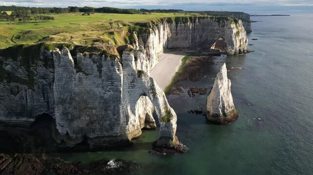 Aerial high angle shot of etretat and famous natural landmark Falaise of Aval white cliffs