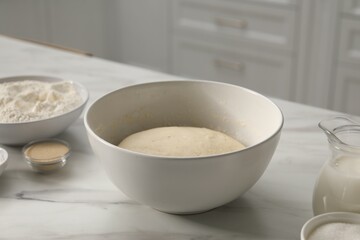 Making pretzels. Dough and ingredients on table in kitchen