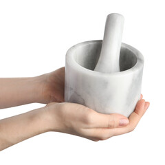 Woman with mortar and pestle on light background, closeup