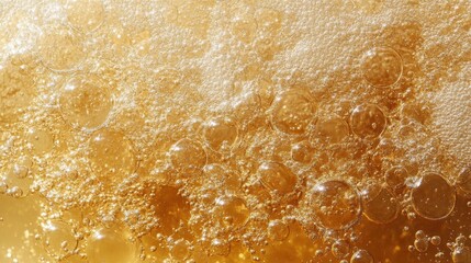 Golden bubbles rise to the surface, creating a captivating texture.