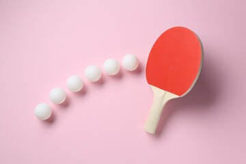 Ping pong racket and balls on pink background, flat lay