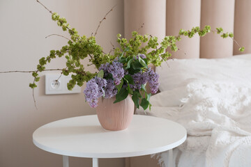 An Elegant and Beautiful Floral Arrangement in a Soft and Serene Bedroom Setting