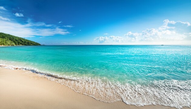 panaromic photo of beach with blue and green toned crystal clear sea and sand as a luxury summer holiday background or backdrop