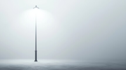 A solitary street lamp stands in the foggy cityscape.