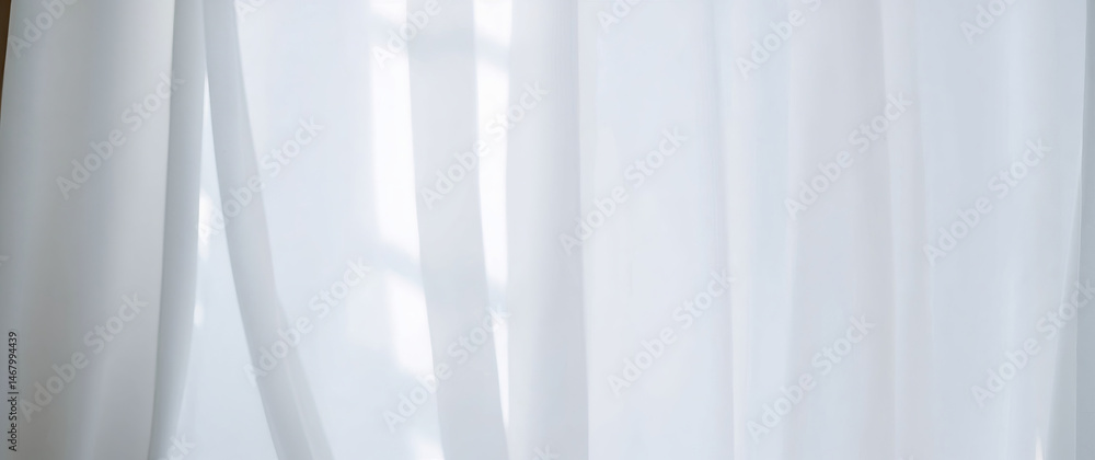 Poster sunlight filtering through white transparent curtains in room