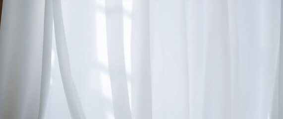 Obraz premium Sunlight filtering through white transparent curtains in room