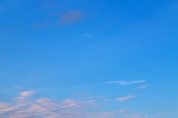 Bright blue sky with gentle clouds captured during a clear day