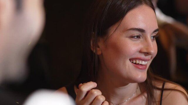 Portrait of focus beautiful charming woman engaging conversation talking with friends in horizontal view. Capturing natural face beauty in essence social upscale atmosphere at night club. Vinosity.