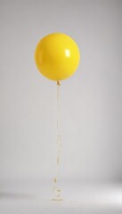 A vibrant yellow balloon floats against a pure white backdrop , up, image