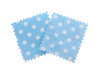 Samples of fabrics with polka dot pattern isolated on white, top view