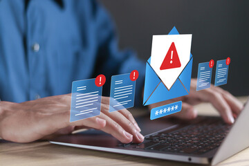 E-mail phishing concept, cyber internet web hack attacks, warning errors, sniffing attacks. Person using laptop with spam malware email alert icon on virtual screen.