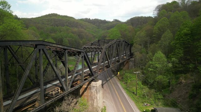 Aerial above train trestle in Maybeury West Virginia on highway 52