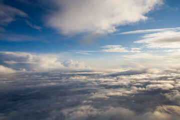 beautiful thick clouds in the sky from the height of the plane