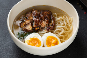 Closeup of ramen soup served at restaurant