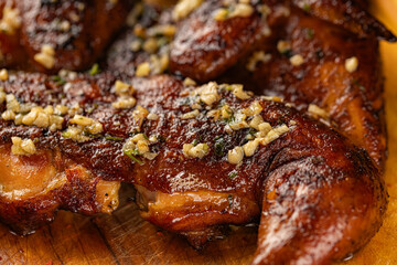 Closeup of roasted grilled whole chicken served at restaurant