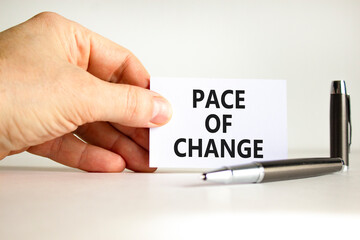 Pace of change symbol. Concept words Pace of change on beautiful white card. Beautiful white background. Businessman hand. Business pace of change concept. Copy space.