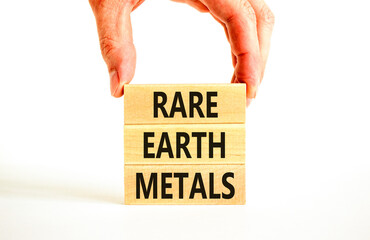 Rare earth metals symbol. Concept words Rare earth metals on beautiful wooden block. Businessman's...