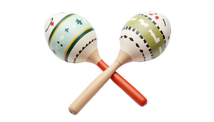 maracas pair with painted wooden handles, placed crossed over each other on white background.