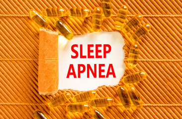 Sleep apnea symbol. Concept words Sleep apnea on beautiful white paper. Yellow pills tablets....